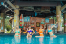 A group of friends enjoying our swim-up bar in Phuket