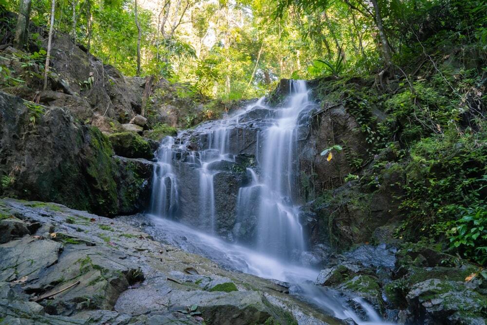 Take a family hike to a waterfall in Phuket.