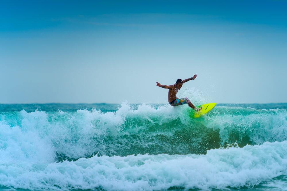 Surfing in Phuket provides a good workout.